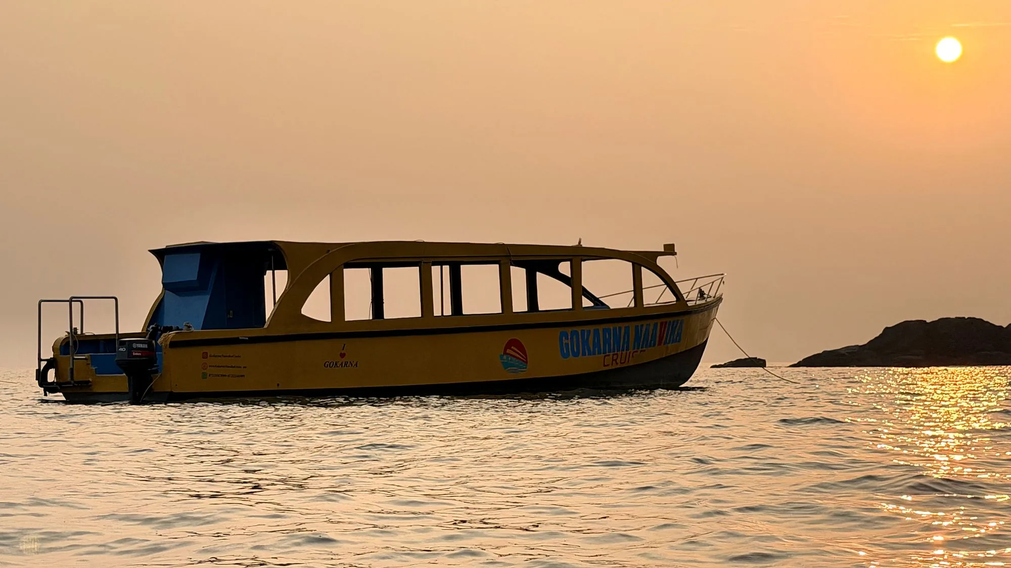 Naavika boat on the sea at sunset
