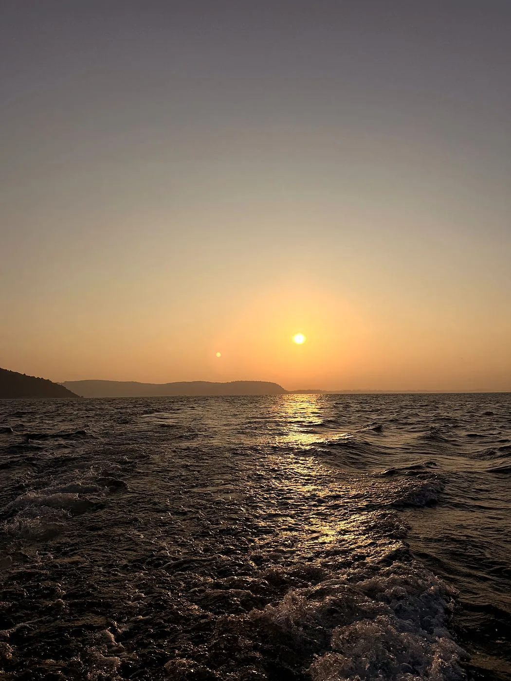 Sunset over the Gokarna coastline from the boat