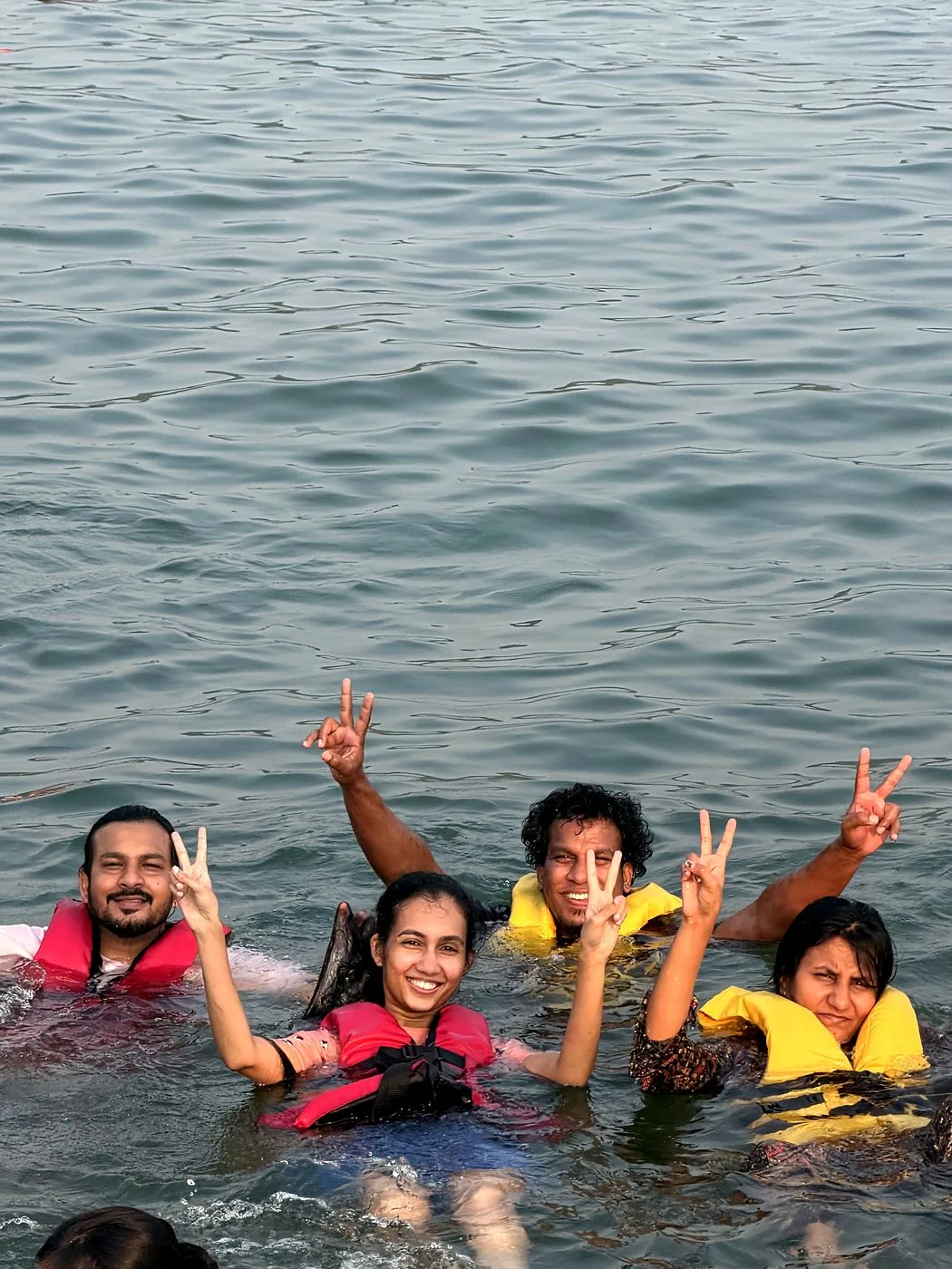 Guests swimming in life jackets in Gokarna waters